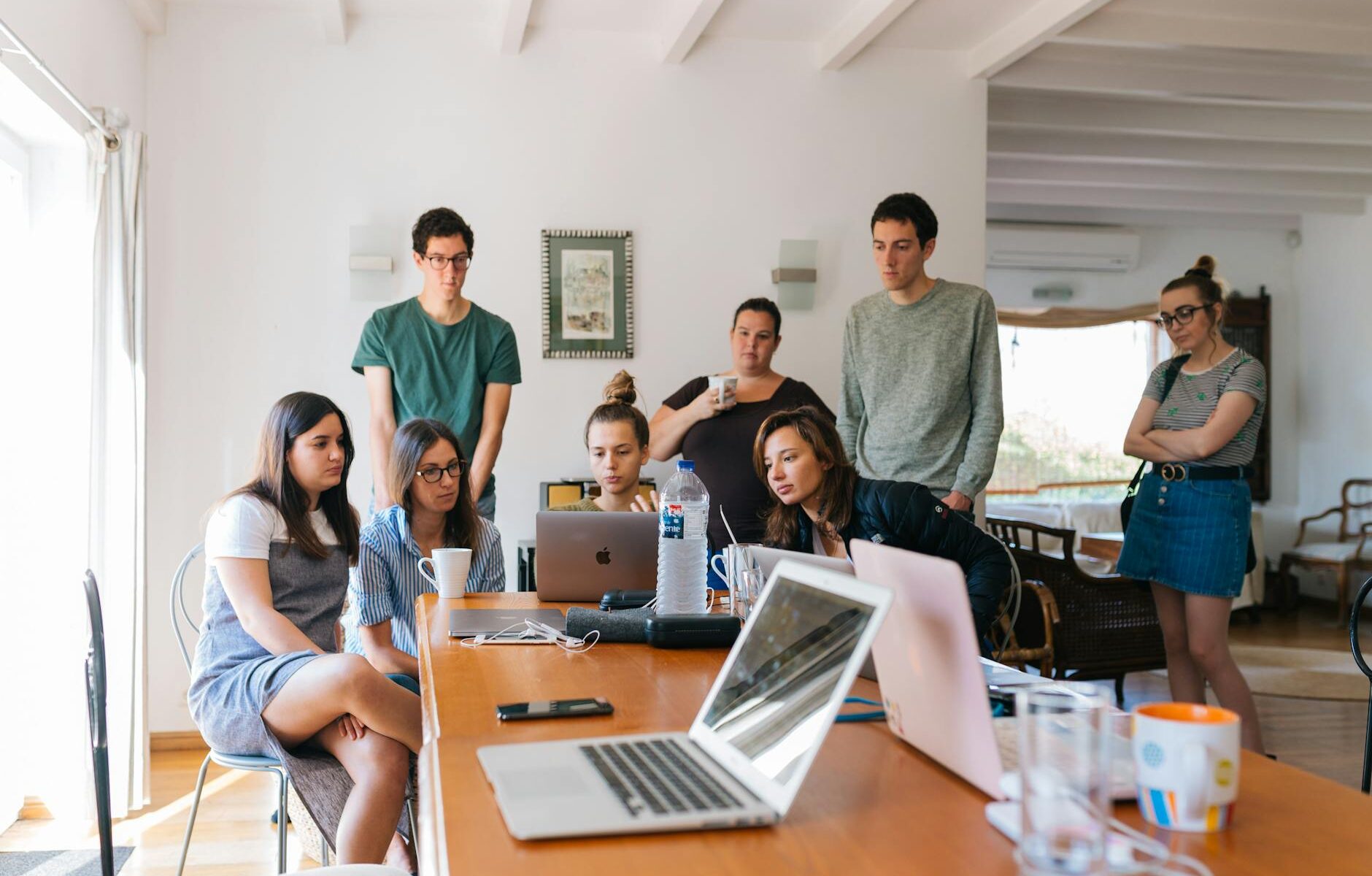 group of people watching on laptop